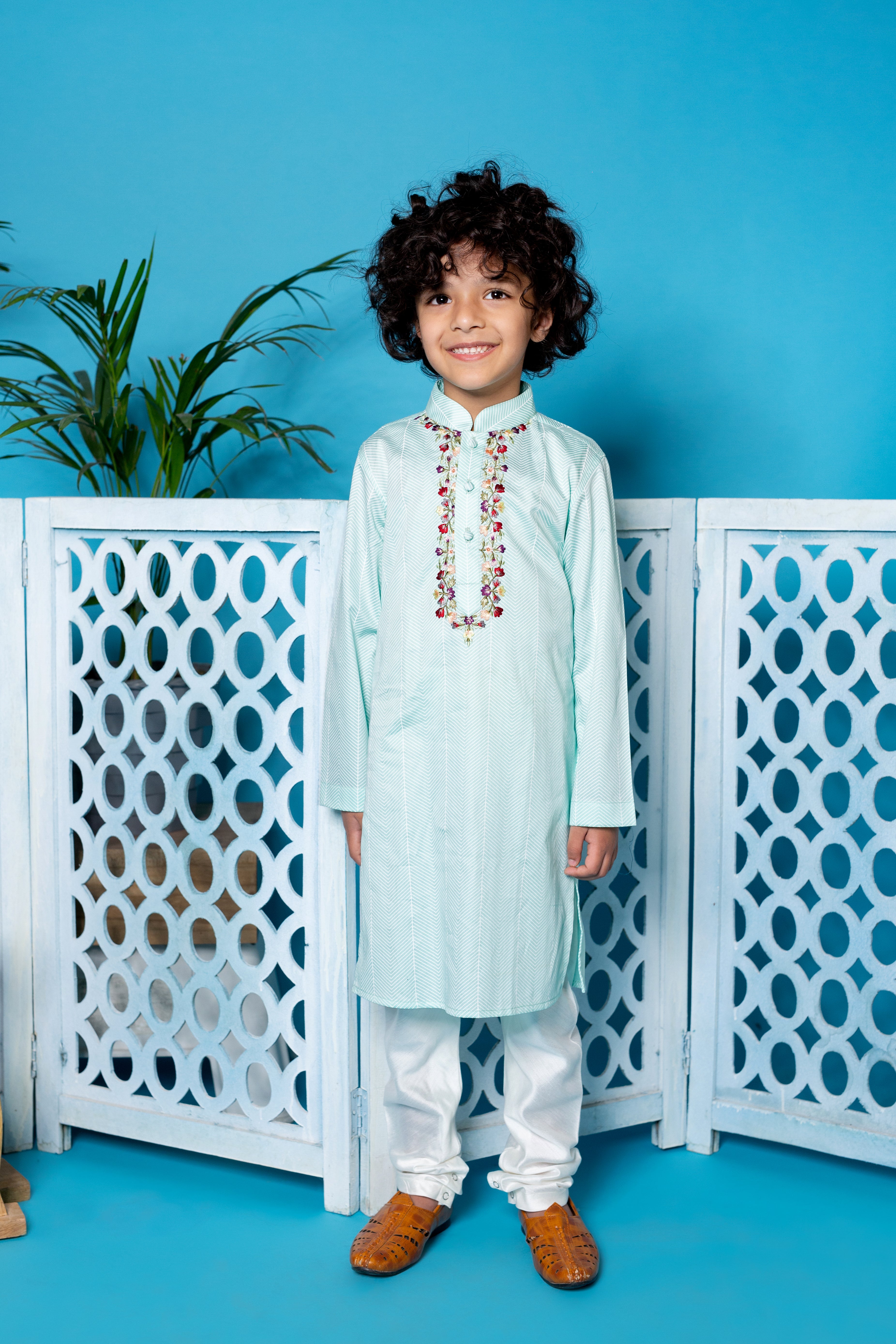 Mint Green Cotton Kurta With Embroidery Teamed With An Off White Churidar