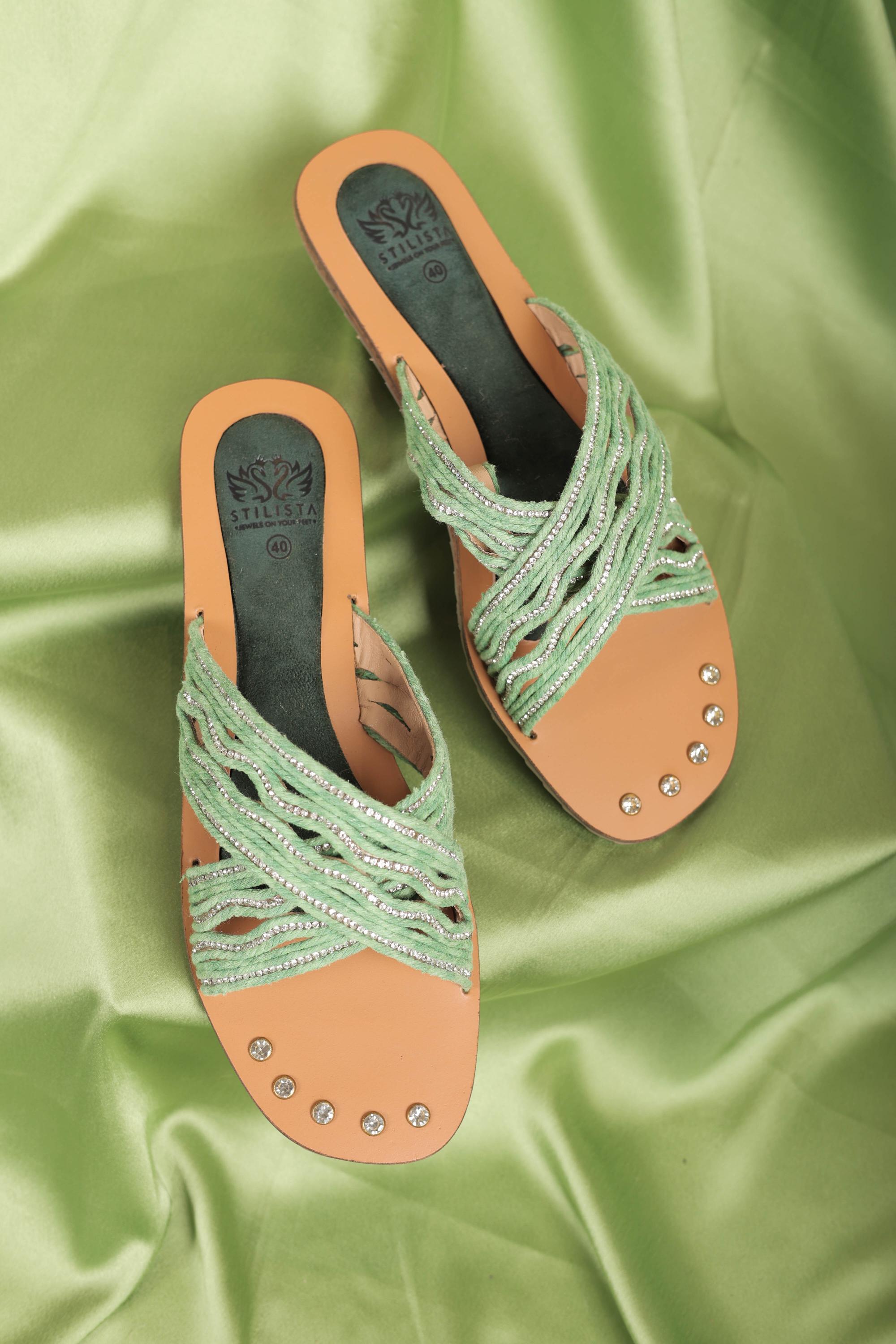 Green cross strap flats in round toe slides