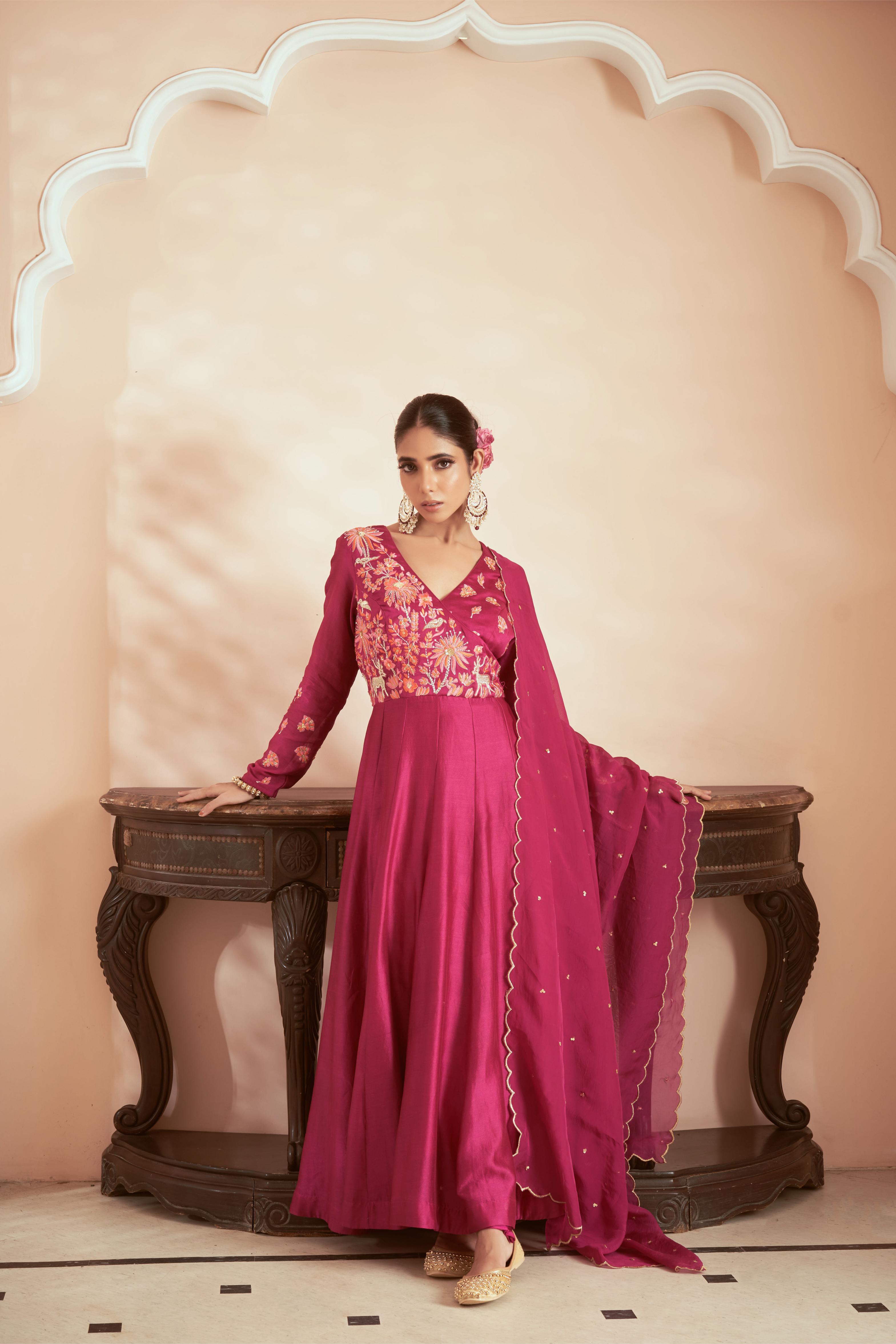 Featuring Dark Magenta Chanderi embroidered Anarkali suit paired with embroidered dupatta and churidar