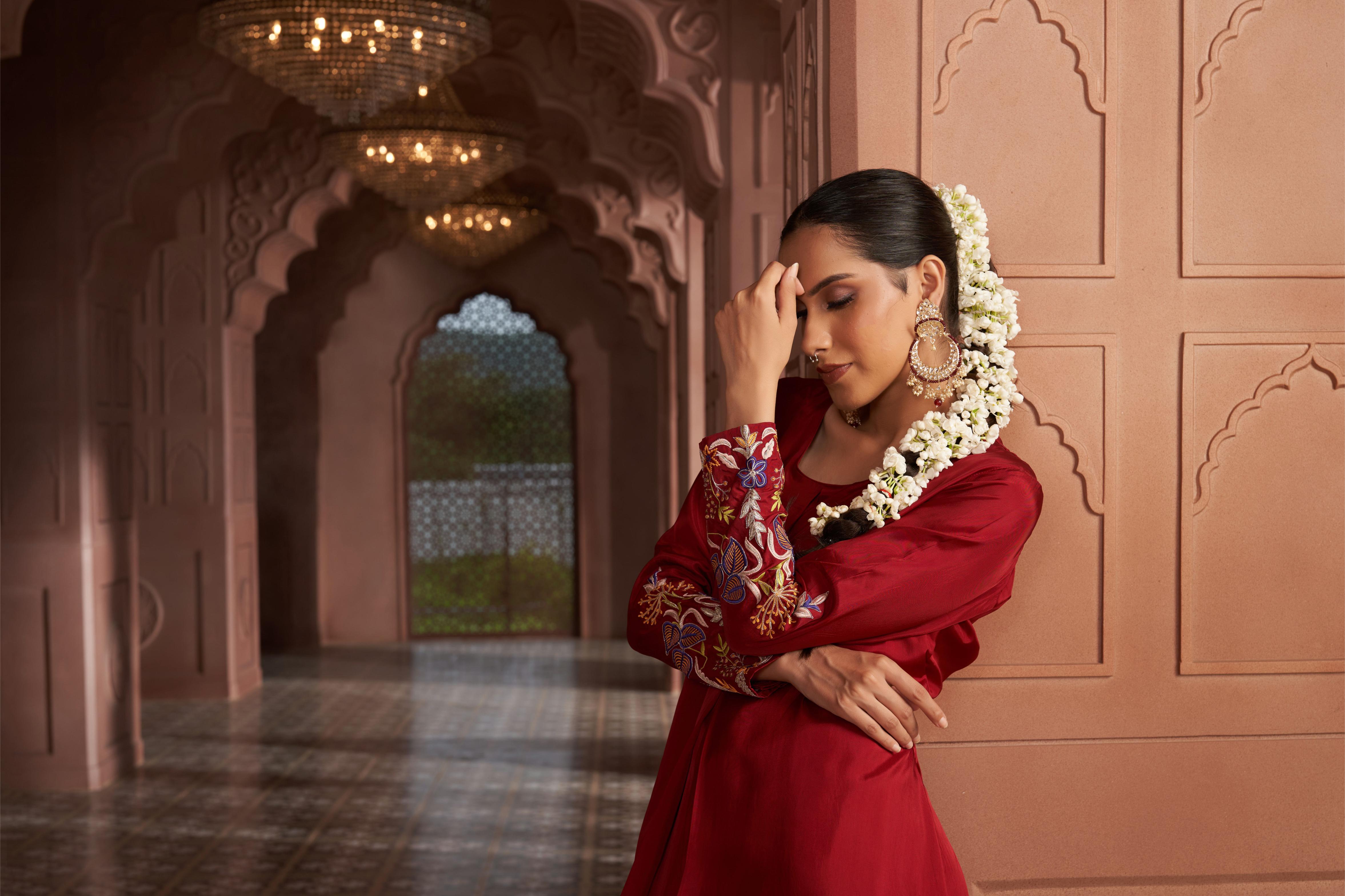 Featuring Maroon Silk thread embroidered kurta paired with silk pants