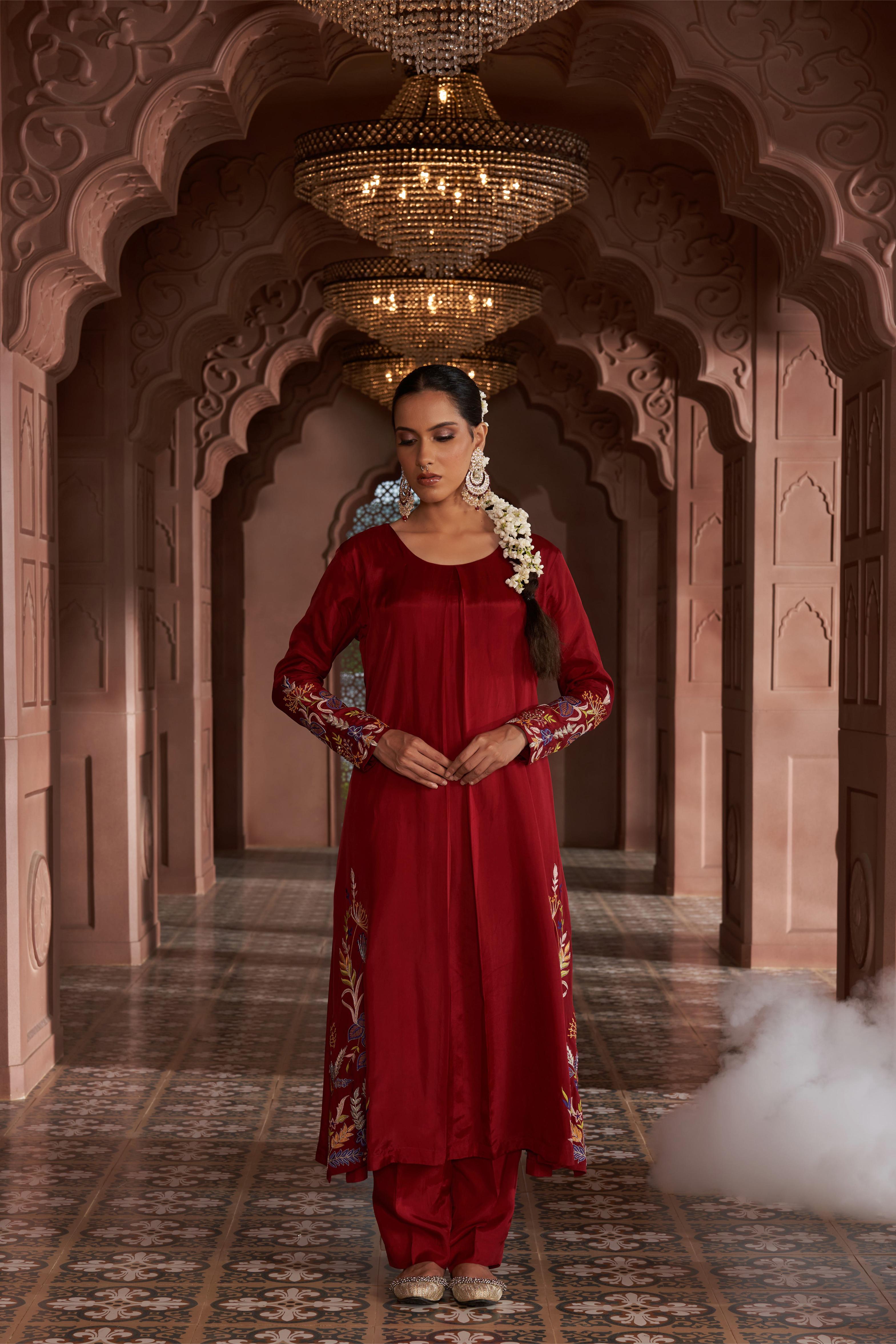 Featuring Maroon Silk thread embroidered kurta paired with silk pants