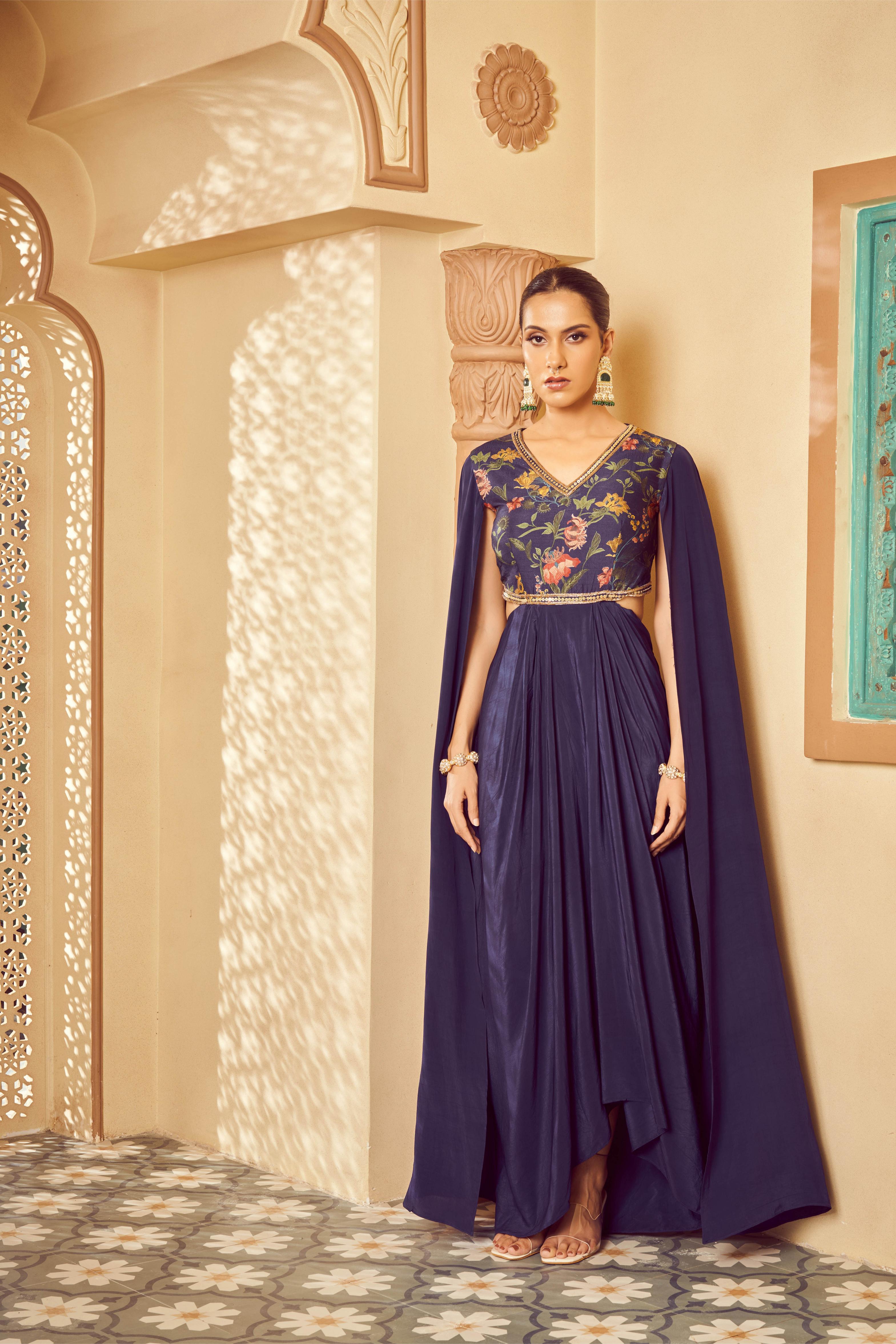 Featuring blue printed and embroidered saree gown with cape style sleeves