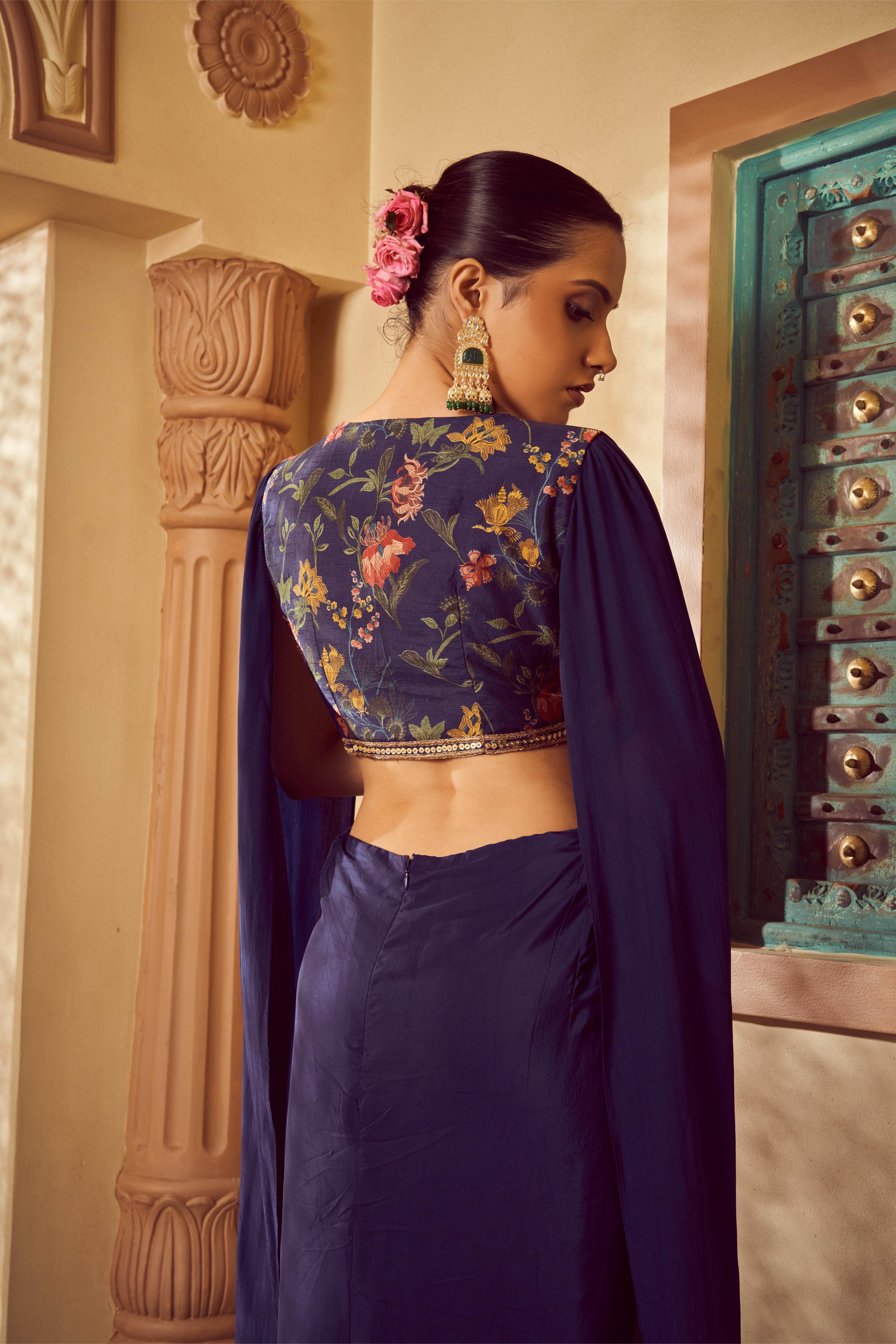 Featuring blue printed and embroidered saree gown with cape style sleeves