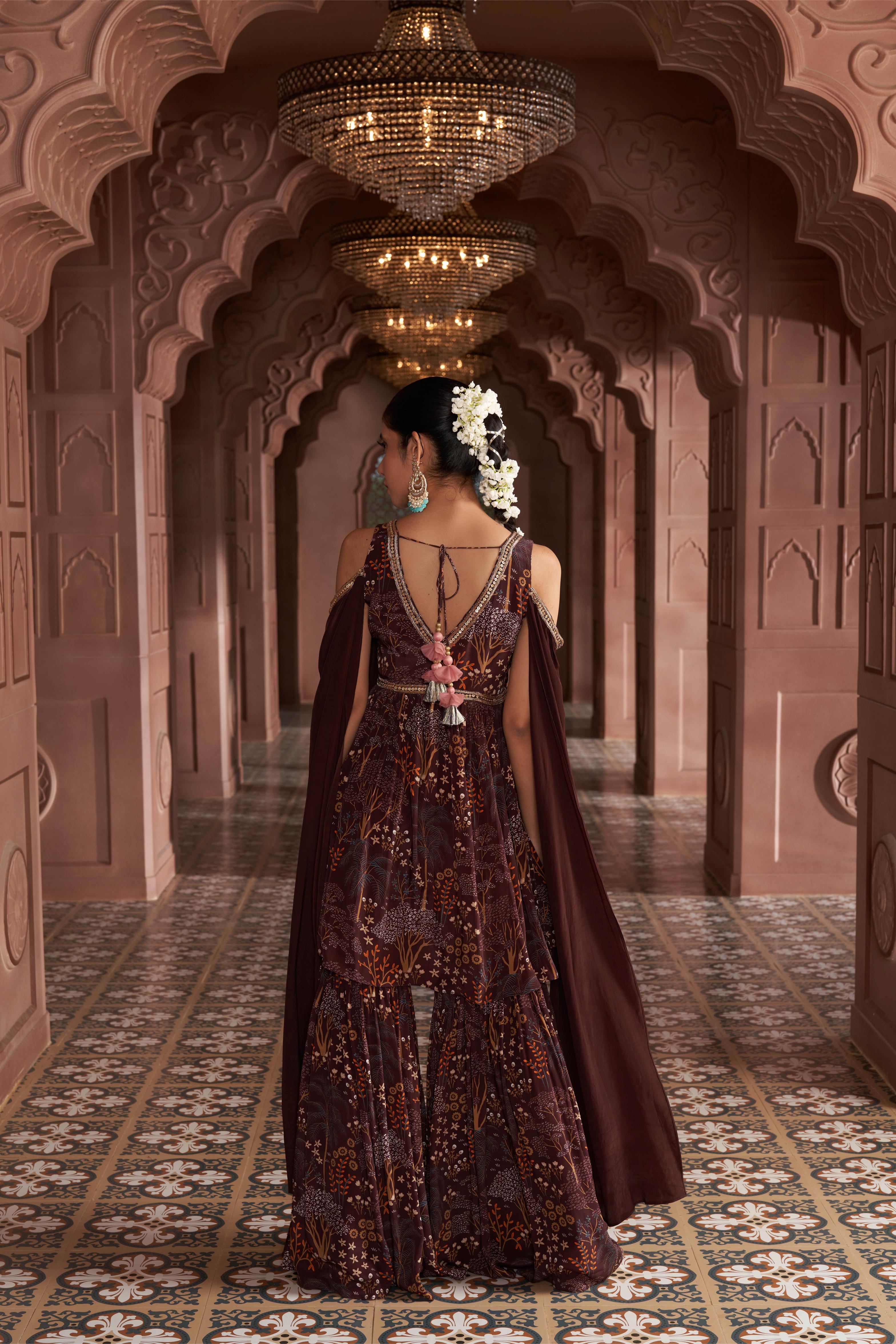 Dark brown crepe sharara set with cape sleeves adorned with hand embroidery