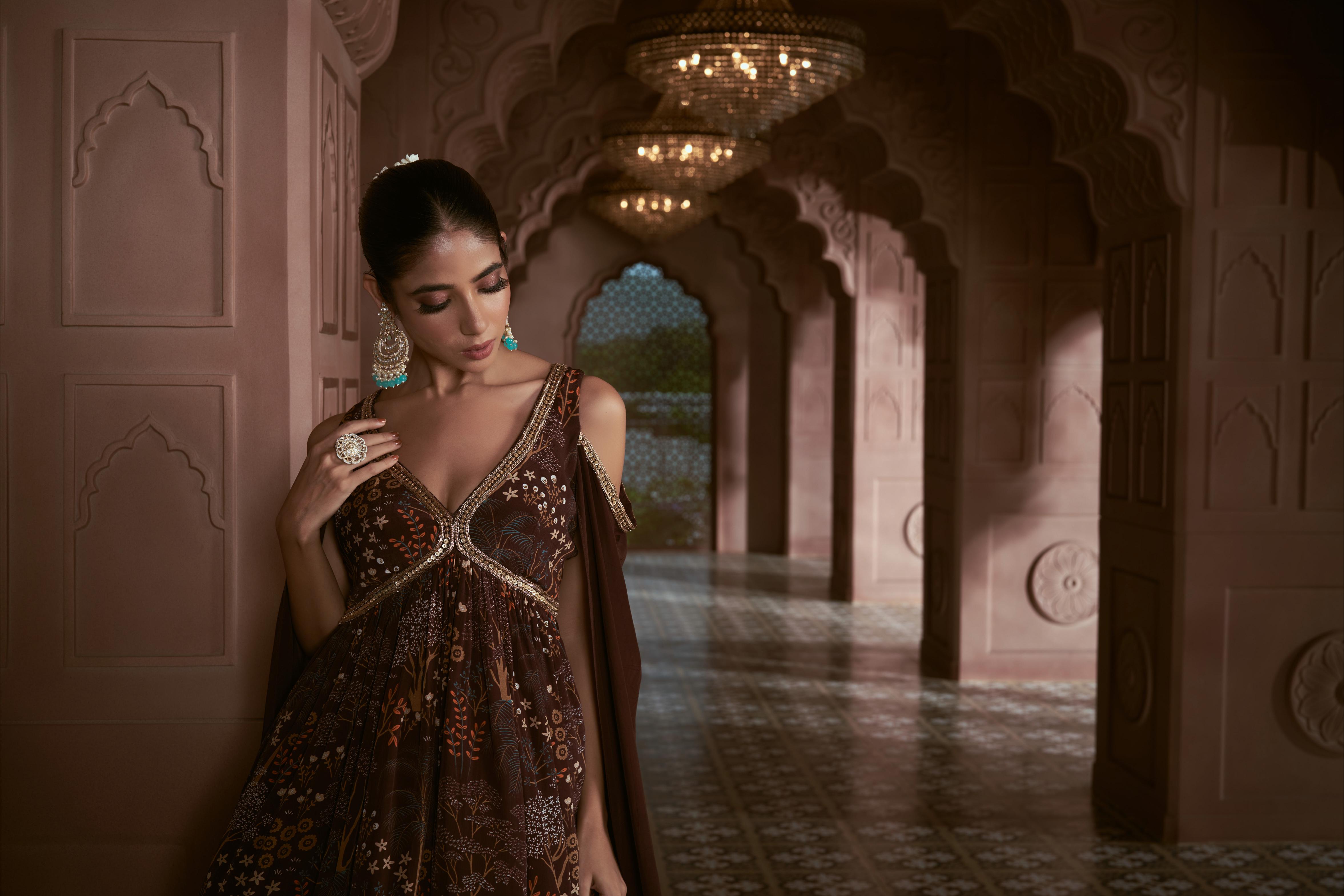 Dark brown crepe sharara set with cape sleeves adorned with hand embroidery