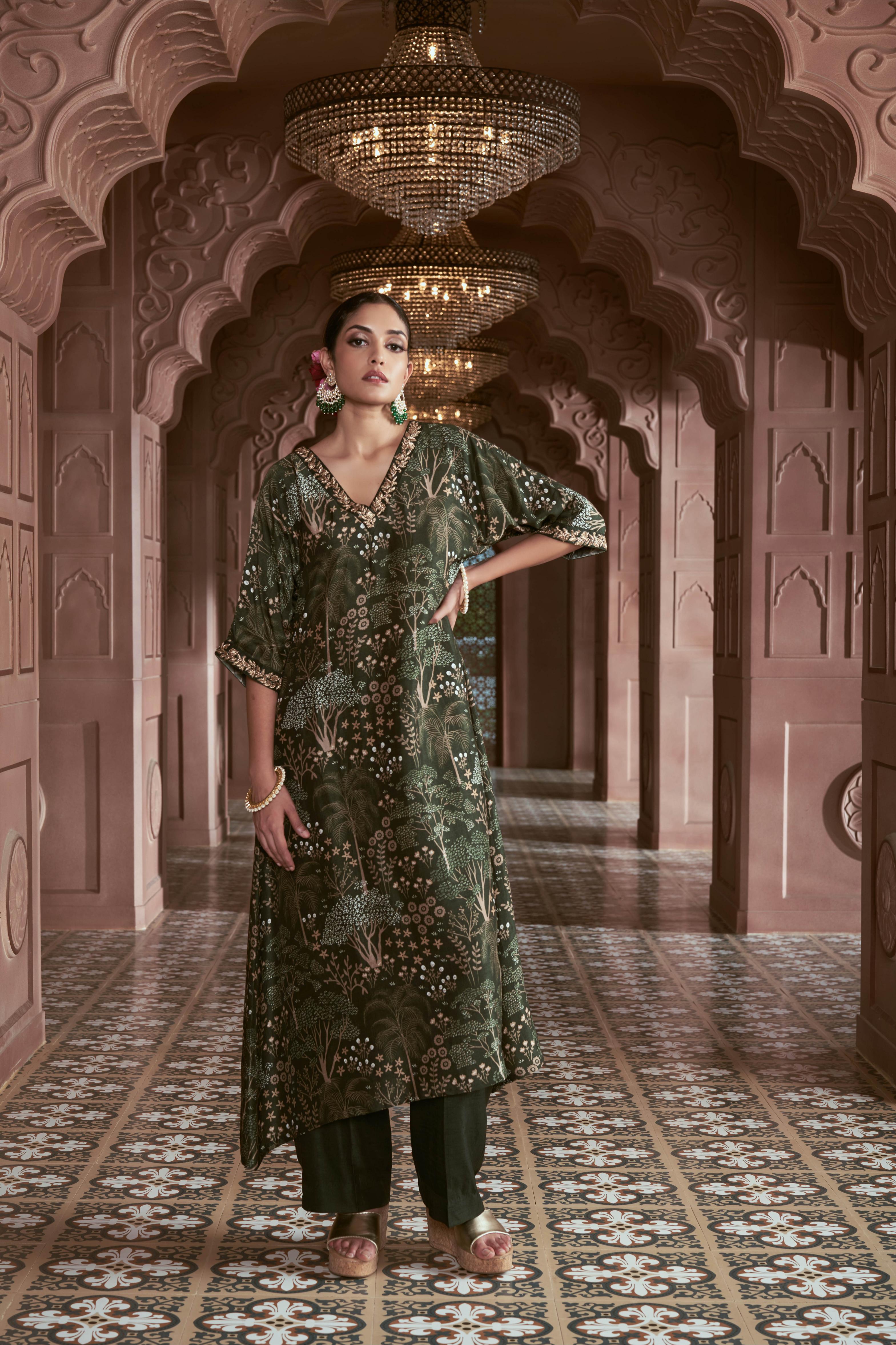 Featuring green signature print kurta with hand embroidery paired with silk pants