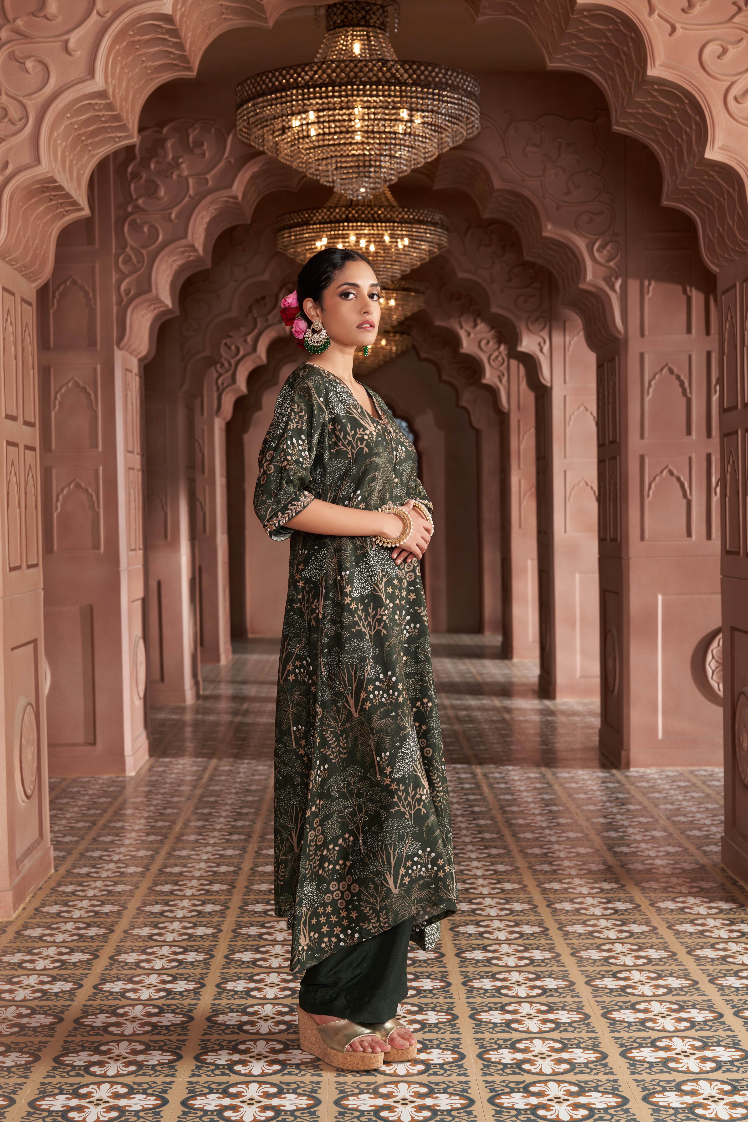 Featuring green signature print kurta with hand embroidery paired with silk pants