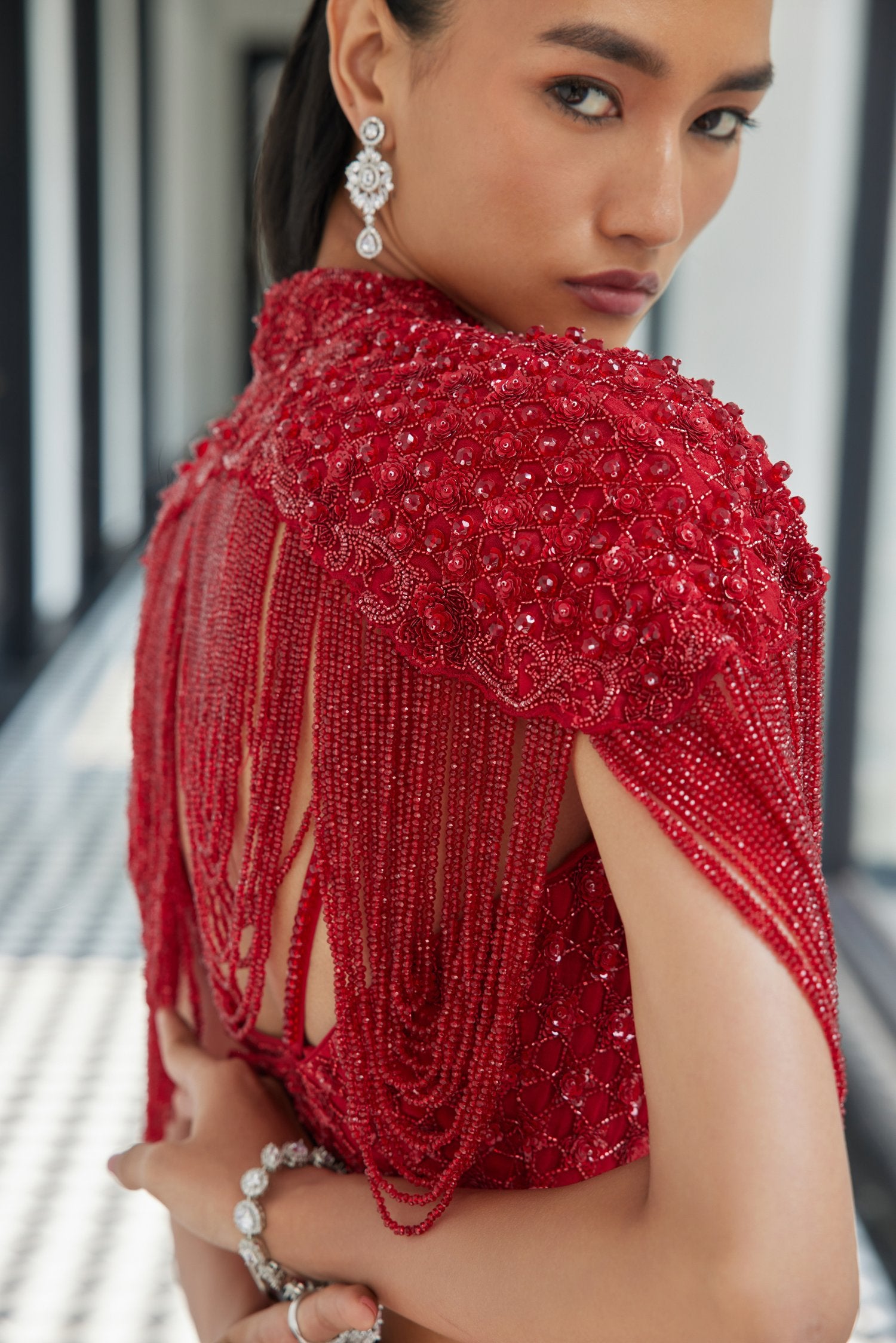 Red Crsytal Cape With A Satin Slit Skirt