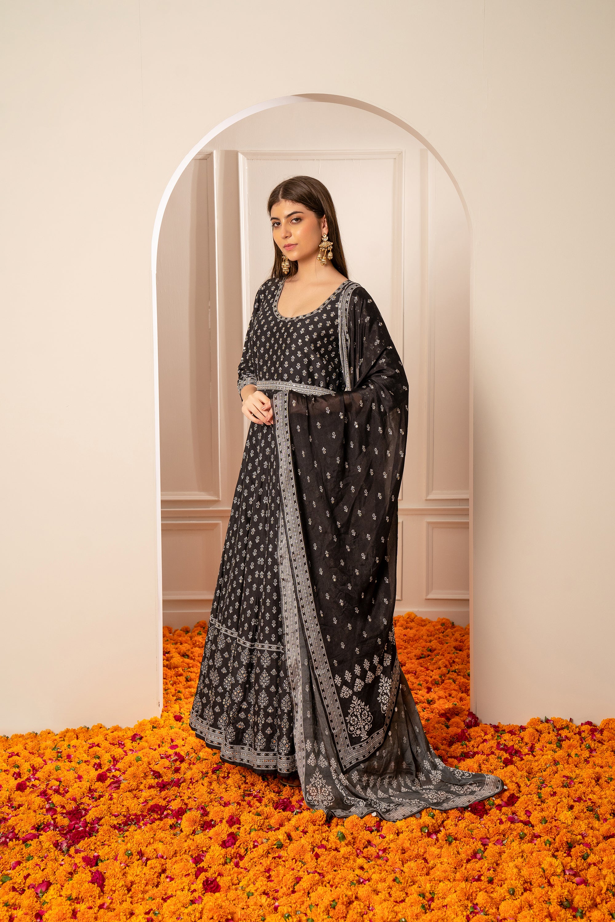 Charcoal Black Semi Silk Printed Gown with Mirror Embellishments.