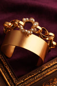 Load image into Gallery viewer, Neutron Loop And Pearl Halo Gold Plated Cuff
